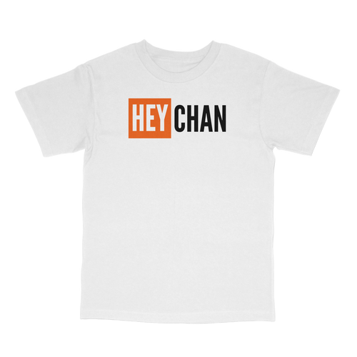 A white short-sleeve crewneck t-shirt featuring a graphic on the chest with the text 'HEY CHAN'. The word 'HEY' is printed in white inside an orange square, while 'CHAN' is printed in black sans-serif font.
