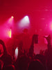 Chandler performing live onstage.