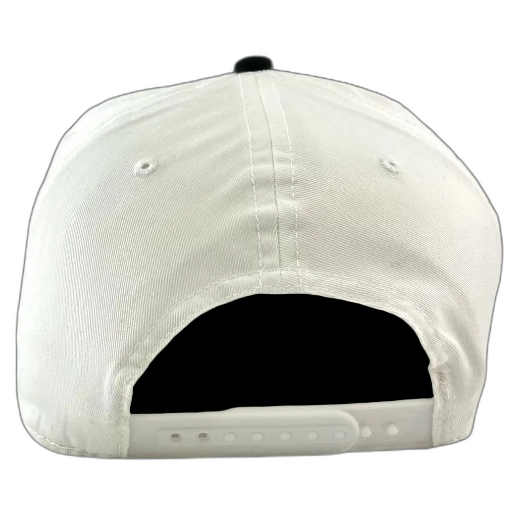 The back view of a white snapback cap with a black button on top and a white adjustable strap underneath.
